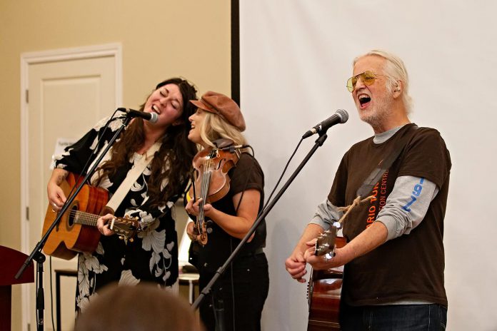 Terra Lightfoot and Melissa Payne join Blue Rodeo's Greg Keelor during a performance at "Raise a Little Shell" at the Ontario Turtle Conservation Centre (OTCC) on September 4, 2025. Emceed by Greg's wife Caolaidhe, a volunteer at OTCC who helped organize the event with the aim of raising awareness of the plight of Ontario's eight native turtle species and the work of the OTCC, the event also included a presentation from OTTC education coordinator Lisa Browning and from Ontario Nature's conservation policy and campaigns director Tony Morris. (Photo: Jordan Lyall Photography for kawarthaNOW) Terra Lightfoot and Melissa Payne join Blue Rodeo's Greg Keelor during a performance at "Raise a Little Shell" at the Ontario Turtle Conservation Centre (OTCC) on September 4, 2025. Emceed by Greg's wife Caolaidhe, a volunteer at OTCC who helped organize the event with the aim of raising awareness of the plight of Ontario's eight native turtle species and the work of the OTCC, the event also included a presentation from OTTC education coordinator Lisa Browning and from Ontario Nature's conservation policy and campaigns director Tony Morris. (Photo: Jordan Lyall Photography for kawarthaNOW)