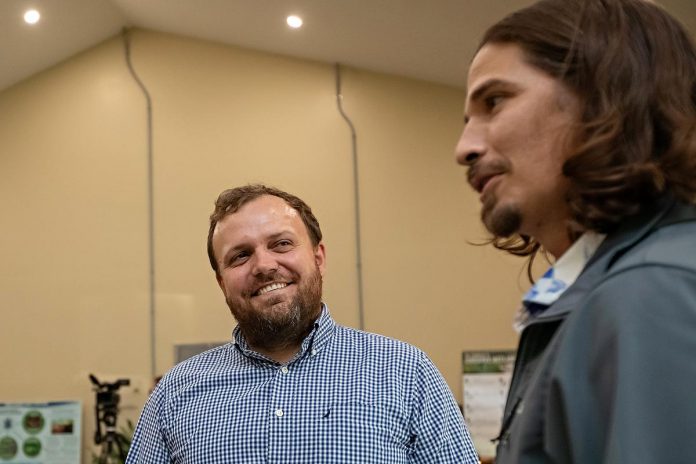 Colin Cassin (left), vice chair of the board of the Ontario Turtle Conservation Centre (OTCC), listens to Ontario Nature executive director Andrés Jiménez Monge during "Raise a Little Shell" at the Ontario Turtle Conservation Centre (OTCC) on September 4, 2025. (Photo: Jordan Lyall Photography for kawarthaNOW)