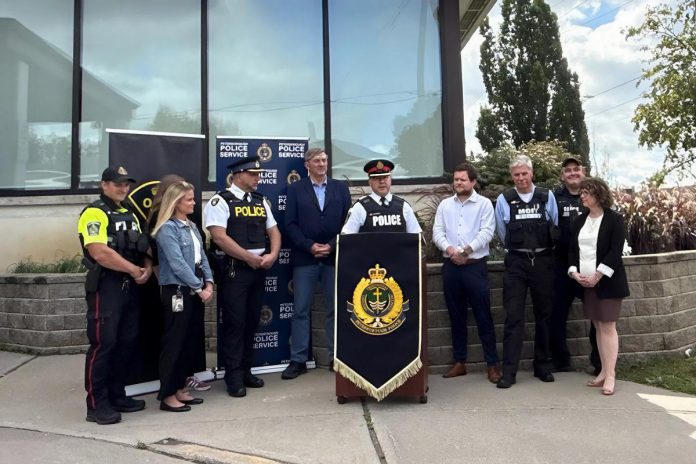 Peterborough-Kawartha MPP Dave Smith, Peterborough police chief Stuart Betts, Peterborough County OPP inspector and detachment commander Chris Galleazza, and representatives from Peterborough Regional Health Centre (PRHC) and the Canadian Mental Health Association Haliburton, Kawartha, Pine Ridge (CMHA HKPR) gathered at the Peterborough police station on September 26, 2025 for an announcement of $426,860.34 in funding over the next two years under the province's Mobile Crisis Response Team (MCRT) Enhancement Grant. (Photo: Peterborough Police Service)