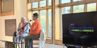 Peterborough County Warden Bonnie Clark with Peterborough and Kawarthas Chamber of Commerce president and CEO Brenda Whitehead, both wearing orange shirts in recognition of National Day for Truth and Reconciliation, during the second annual Warden's Breakfast in the Peterborough County Agricultural Heritage Building at Keene's Lang Pioneer Village Museum on September 30, 2025. (Photo: Jeannine Taylor / kawarthaNOW