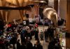 Guests at the Lakeside Gala at The Canadian Canoe Museum in Peterborough on October 4, 2025 listen to a speech by the museum's executive director Carolyn Hyslop and curator Jeremy Ward in the museum's atrium during the inaugural event that raised $150,000 in support of the not-for-profit museum and its programming. (Photo courtesy of The Canadian Canoe Museum)
