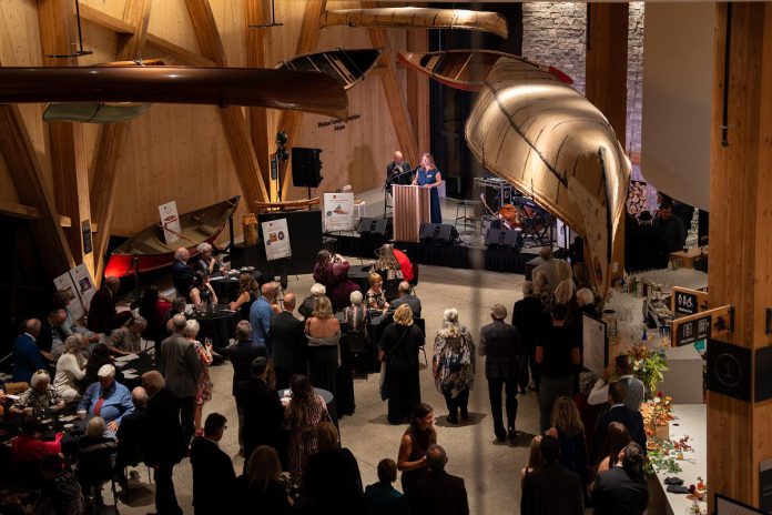 Guests at the Lakeside Gala at The Canadian Canoe Museum in Peterborough on October 4, 2025 listen to a speech by the museum's executive director Carolyn Hyslop and curator Jeremy Ward in the museum's atrium during the inaugural event that raised $150,000 in support of the not-for-profit museum and its programming. (Photo courtesy of The Canadian Canoe Museum)