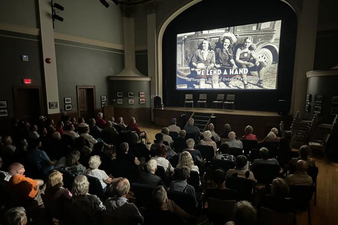 An audience in Stratford watches a screening of "We Lend A Hand: The Forgotten Story of Ontario Farmerettes", produced and directed by Colin Field with historical producer Bonnie Sitter, who wrote the 2019 book "Onion Skins and Peach Fuzz: Memories of Ontario Farmerettes" with retired journalist Shirleyan English. (Photo via welendahand.ca) An audience in Stratford watches a screening of "We Lend A Hand: The Forgotten Story of Ontario Farmerettes", produced and directed by Colin Field with historical producer Bonnie Sitter, who wrote the 2019 book "Onion Skins and Peach Fuzz: Memories of Ontario Farmerettes" with retired journalist Shirleyan English. (Photo via welendahand.ca)