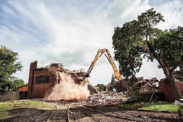 The 2014 demolition of Building 7 at the General Electric factory complex in downtown Peterborough captured by photographer Wayne Eardley as part of his "Caribou" series that was featured at the 2016 SPARK Photo Festival and the Art Gallery of Peterborough. Building 7 was part of the General Electric's armature department, which built coils for motors and generators, stators, DC motors, armatures, and more. (Photo: Wayne Eardley) The 2014 demolition of Building 7 at the General Electric factory complex in downtown Peterborough captured by photographer Wayne Eardley as part of his "Caribou" series that was featured at the 2016 SPARK Photo Festival and the Art Gallery of Peterborough. Building 7 was part of the General Electric's armature department, which built coils for motors and generators, stators, DC motors, armatures, and more. (Photo: Wayne Eardley)