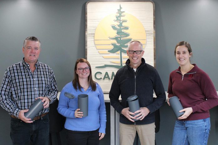 Cambium Consulting & Engineering staff show off their recycled plastic concrete molds. By turning their previously discarded plastic molds into reusable ones, the Peterborough firm is proving how businesses can lead the way in building a circular economy. From left to right: facilities and environmental health and safety manager Jeff Hoskin, technologist and green team representative Hillary Bradshaw, group manager for construction testing and inspection Brian Graham, and coordinator and green team representative Becky Yarnell. (Photo: Connor Evans / Cambium) Cambium Consulting & Engineering staff show off their recycled plastic concrete molds. By turning their previously discarded plastic molds into reusable ones, the Peterborough firm is proving how businesses can lead the way in building a circular economy. From left to right: facilities and environmental health and safety manager Jeff Hoskin, technologist and green team representative Hillary Bradshaw, group manager for construction testing and inspection Brian Graham, and coordinator and green team representative Becky Yarnell. (Photo: Connor Evans / Cambium)