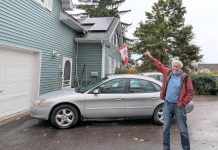 Lakefield resident Guy Hanchet proudly displays his newly installed solar panels. Despite not having an ideal rooftop for solar, he expects to power about half of his annual electricity use from the system. (Photo: Clara Blakelock / GreenUP)