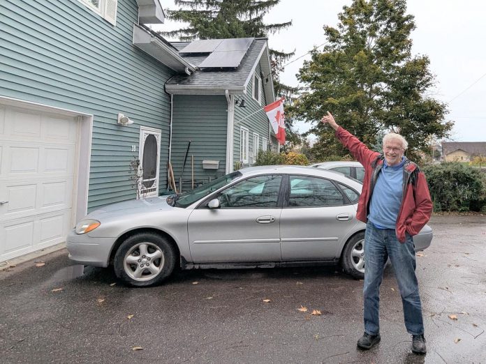 Lakefield resident Guy Hanchet proudly displays his newly installed solar panels. Despite not having an ideal rooftop for solar, he expects to power about half of his annual electricity use from the system. (Photo: Clara Blakelock / GreenUP) Lakefield resident Guy Hanchet proudly displays his newly installed solar panels. Despite not having an ideal rooftop for solar, he expects to power about half of his annual electricity use from the system. (Photo: Clara Blakelock / GreenUP)
