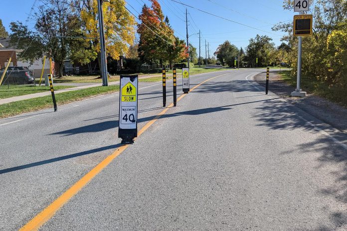 Enhanced road safety treatments were installed at five local school sites featuring enhanced signage, bollards, road markings, and transverse rumble strips. St. Patrick Catholic Elementary School is one of the pilot sites, with several treatments installed along Otonabee Drive. (Photo: Ashley Burnie Seeds / GreenUP)