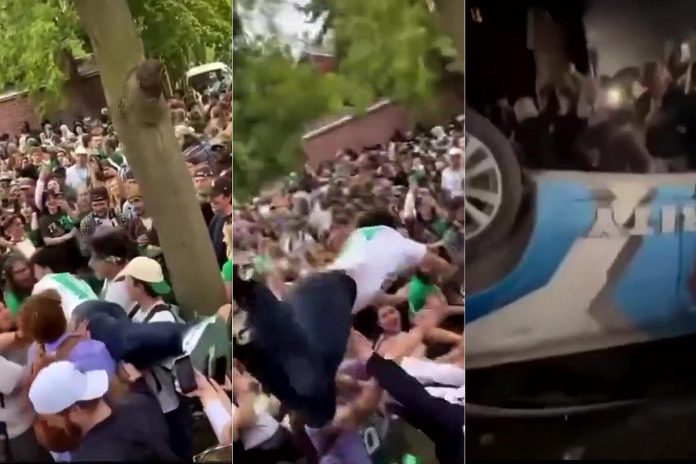On October 1, 2022, a crowd of around 500 young people gathered in downtown Peterborough during Trent University's Head of the Trent weekend and, in one incident, a private security car was flipped over on London Street. (kawarthaNOW screenshots of social media videos)