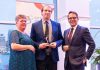 Joel Wiebe (middle) receiving the James Gordon Carnegie Memorial Award from the Ontario Chamber of Commerce in April 2025. After almost five years with the Peterborough and Kawarthas Chamber of Commerce, including the past three as vice president of government relations and operations, Wiebe is leaving the chamber on October 3, 2025 to take on the role of senior advisor, community relations with Alto, Canada's first high-speed railway, which is currently under development. (Photo: Ontario Chamber of Commerce)