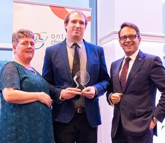 Joel Wiebe (middle) receiving the James Gordon Carnegie Memorial Award from the Ontario Chamber of Commerce in April 2025. After almost five years with the Peterborough and Kawarthas Chamber of Commerce, including the past three as vice president of government relations and operations, Wiebe is leaving the chamber on October 3, 2025 to take on the role of senior advisor, community relations with Alto, Canada's first high-speed railway, which is currently under development. (Photo: Ontario Chamber of Commerce)