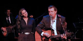 Karen Coughlin and Aaron Solomon perform as June Carter Cash and Johnny Cash in a production of "Johnny & June" at Hudson Village Theatre in Quebec in 2023. The jukebox musical comes to Globus Theatre in Bobcaygeon for five performances from October 23 to 25, 2025. (Photo: Hudson Village Theatre)