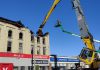 A grapple removes debris from the fire-devastated Kawartha Home Hardware building in downtown Lakefield on October 12, 2025 as a Priestly Demolition Inc. employee supervises from a boom truck. (Photo: Scott Norwood)