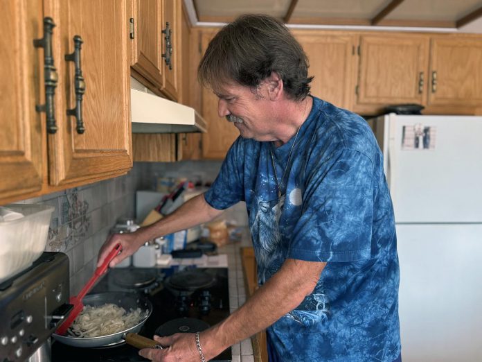 Bowmanville resident Mike Leach was grateful to have been given lifesaving vascular care close to home at the Peterborough Regional Health Centre (PRHC). Instead of having to travel to Toronto for the care, he was able to get treatment close to home, allowing him to get back to the things he loves like cooking, gardening, and woodworking. A hybrid operating room would have allowed him to do so even more quickly, as he could have received his two surgeries at the same time rather than months apart. (Photo courtesy of PRHC Foundation)