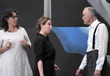 Lisa Dixon (left) directs Gayle Fraser and David Russell during a rehearsal for the Peterborough Theatre Guild's production of "291" by Jade O'Keeffe, Dixon's daughter. The play, which tells the love story of American modernist painter and draftswoman Georgia O'Keeffe and American photographer and modern art promoter Alfred Stieglitz, runs for nine performances from November 1 to 15, 2025. (kawarthaNOW screenshot of Peterborough Theatre Guild video)