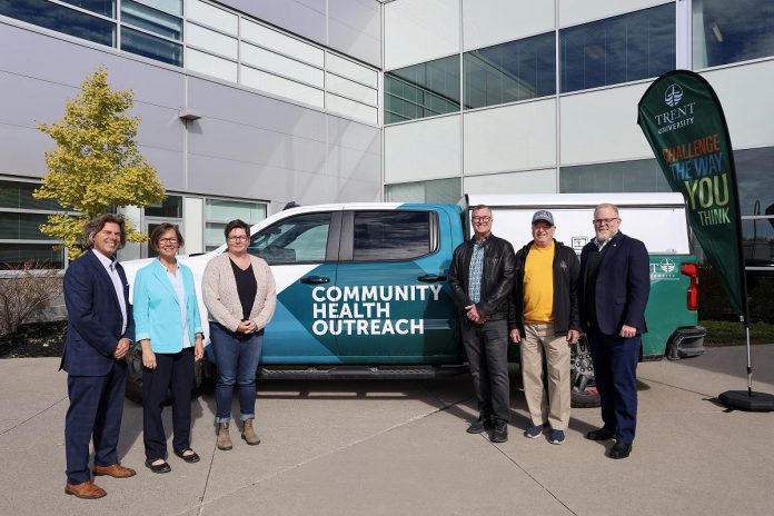 Trent/Fleming School of Nursing dean Dr. Hugo Lehmann and associate dean Dr. Ellen Buck-McFadyen, nurse practitioner and Trent University clinical instructor Erinne Stevens, donors Brad Holland and Bryan Davies, and Trent University provost and vice-president Dr. Mark Skinner in front of the new donor-funded community health outreach vehicle that the Peterborough Community Health Centre will use to improve primary healthcare services to rural and Indigenous communities in Peterborough County while also providing nursing students with practical experience. (Photo courtesy of Trent University)