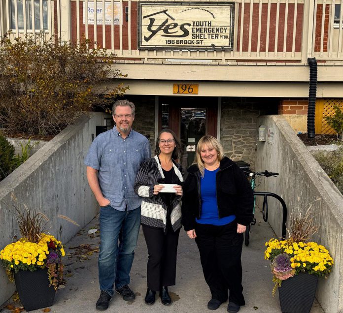 Peterborough residents Justin Sutton and Danielle Turpin, who organized and co-hosted the Charlie Angus event, presented a cheque for $4,300 to YES Shelter for Youth and Families executive director Aimeé Le Lagadec (right) on November 4, 2025. (Photo courtesy of Justin Sutton and Danielle Turpin)