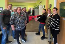 Peer-led program launches in Haliburton County to support people with substance use and mental health challenges Point in Time executive director Marg Cox (second from left) and Canadian Mental Health Association Haliburton, Kawartha, Pine Ridge (CMHA HKPR) program supervisor David Bradley (fourth from left) along with peer specialists cut the ribbon for "Coming Full Circle" at 83 Maple Avenue in Haliburton on November 4, 2025. Funded by Health Canada, the two-year initiative is designed to help people with mental health and addiction challenges succeed by building a network of trained and mentored workers who have lived experience. (Photo: CMHA HKPR)