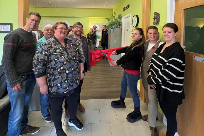 Point in Time executive director Marg Cox (second from left) and Canadian Mental Health Association Haliburton, Kawartha, Pine Ridge (CMHA HKPR) program supervisor David Bradley (fourth from left) along with peer specialists cut the ribbon for "Coming Full Circle" at 83 Maple Avenue in Haliburton on November 4, 2025. Funded by Health Canada, the two-year initiative is designed to help people with mental health and addiction challenges succeed by building a network of trained and mentored workers who have lived experience. (Photo: CMHA HKPR) Point in Time executive director Marg Cox (second from left) and Canadian Mental Health Association Haliburton, Kawartha, Pine Ridge (CMHA HKPR) program supervisor David Bradley (fourth from left) along with peer specialists cut the ribbon for "Coming Full Circle" at 83 Maple Avenue in Haliburton on November 4, 2025. Funded by Health Canada, the two-year initiative is designed to help people with mental health and addiction challenges succeed by building a network of trained and mentored workers who have lived experience. (Photo: CMHA HKPR)
