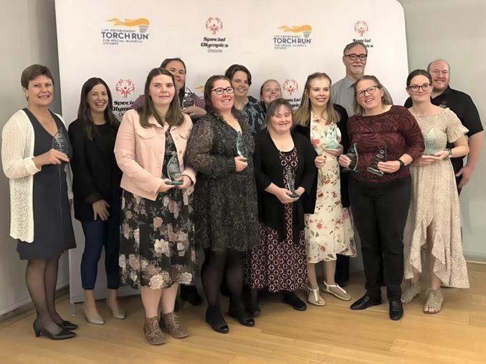 The Blazers Women's Basketball team for Special Olympics Peterborough (Candace Bushie, Tessa Scates, Kacee Quinlan, Emma Keating, Lisa Butler, Miriam McHugh, Kristin Lackey, Crystal Cochrane, Gillian McHugh) with head coach Bev Quinlan, assistant coach Debbie Quinlan, and a Special Olympic Ontario representative celebrating their win of "Team of the Year" during the 2025 Special Olympics Ontario AGM and Awards Banquet held on October 23, 2025 in Aurora. (Photo courtesy of Debbie Quinlan)