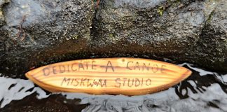 Daniel Marlatt, an elemental artist at Miskwaa Art Studio and Outdoor Gallery in Trent Lakes, has announced his free "Dedicate a Canoe" project inviting community members to dedicate a six-inch canoe handcarved by the artist to a loved one and send it down the Miskwaa Ziibi river at Marlatt's studio in spring 2026. The free-of-charge project is inspired by the similar "lil Red Canoe" project and blog that Marlatt launched in 2019. (Photo courtesy of Daniel Marlatt)