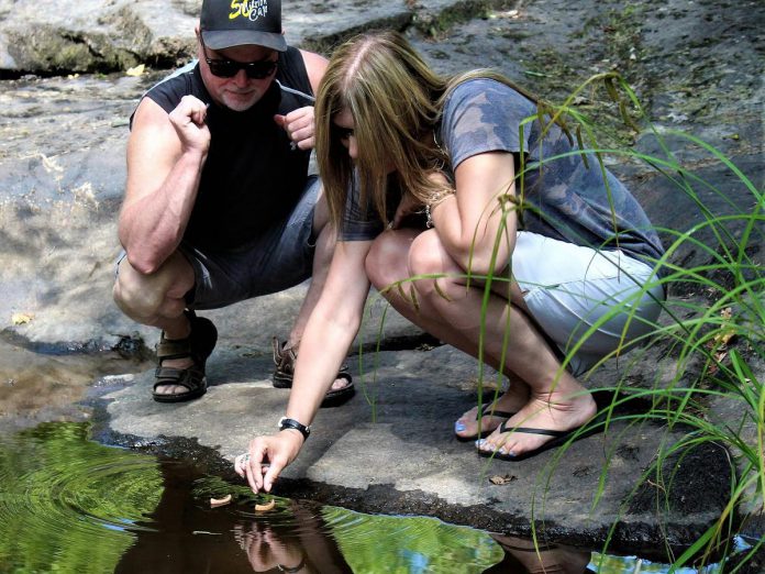 When watching visitors release miniature canoes in memory of a lost loved one through his "lil Red Canoe" project, artist Daniel Marlatt often noticed participants being flooded with a sense of relief and feeling "set free." For his upcoming "Dedicate a Canoe" project, Marlatt will be inviting participants to send six-inch canoe handcarved by the artist and engraved with a message of choice down the Miskwaa Ziibi river Miskwaa Art Studio & Outdoor Gallery. (Photo courtesy of Daniel Marlatt)