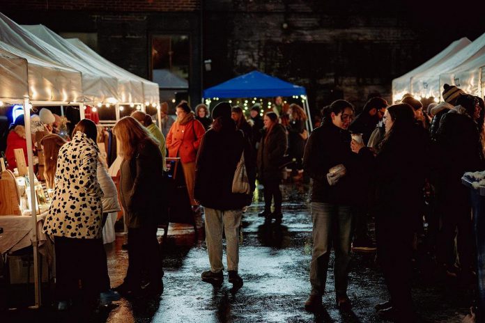 The fourth annual Holiday Night Market, held in the Bankers Commons Courtyard off Water Street in downtown Peterborough on December 5, 2025, takes place during the First Friday monthly art crawl. In addition to shopping at the holiday market, arts enthusiasts can visit various artist studios in the Commerce Building and Hunter and Water streets as well as exhibits and events at other locations in downtown Peterborough, which artwork will be available for purchase. (Photo: Luke Best)