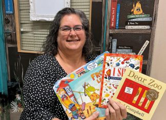 Five Counties Children’s Centre encourages families to skip the gadgets this year and put books under the tree Speech-language pathologist Ida Lloyd at Five Counties Children's Centre displays a few of the books that clinicians at the regional treatment centre recommend parents and caregivers put under the tree for children this holiday season. (Photo: Five Counties Children's Centre)