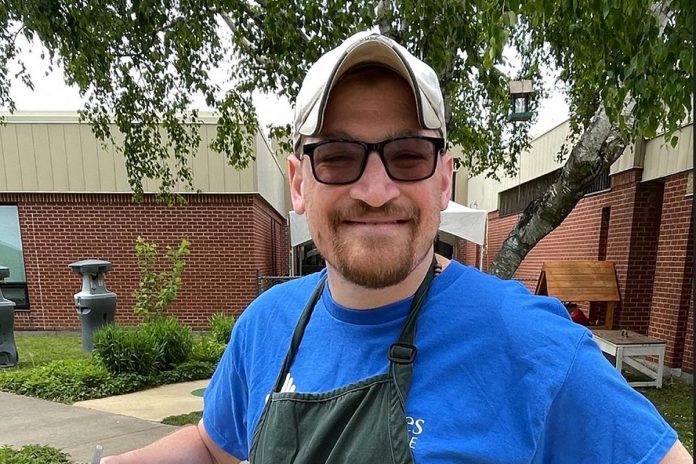 Jordie Barrie credits the treatment he received as a child at Five Counties Children's Centre for helping him succeed as an adult, including in his career as a patient transfer attendant at Peterborough Regional Health Centre, where staff call him "the world's cheerleader." He also enjoys giving back to the community, such as volunteering at the Backyard Summer Social fundraising event in support of Five Counties. (Photo courtesy of Five Counties Children's Centre) Jordie Barrie credits the treatment he received as a child at Five Counties Children's Centre for helping him succeed as an adult, including in his career as a patient transfer attendant at Peterborough Regional Health Centre, where staff call him "the world's cheerleader." He also enjoys giving back to the community, such as volunteering at the Backyard Summer Social fundraising event in support of Five Counties. (Photo courtesy of Five Counties Children's Centre)