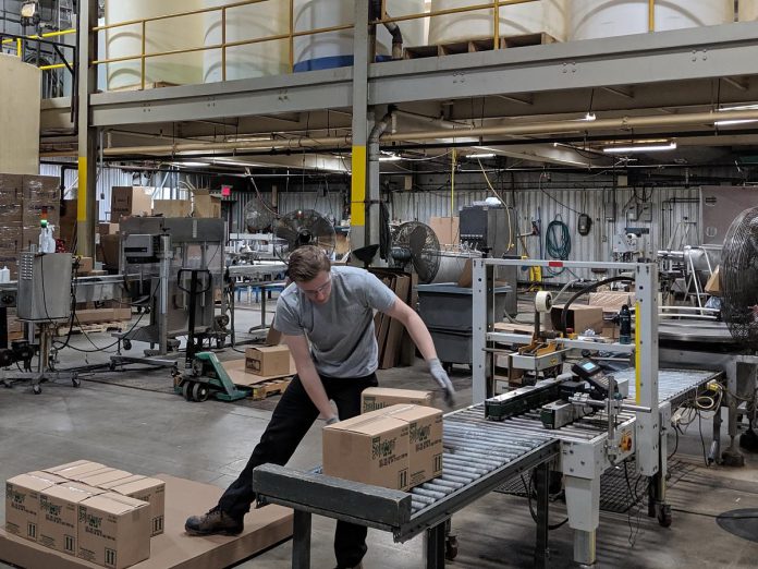 Inside Charlotte Products' Peterborough facility, staff oversee the packaging of environmentally responsible cleaning products. The company uses a supply chain that emphasizes Ontario-based materials and partnerships to minimize emissions and cost. (Photo courtesy of Charlotte Products)