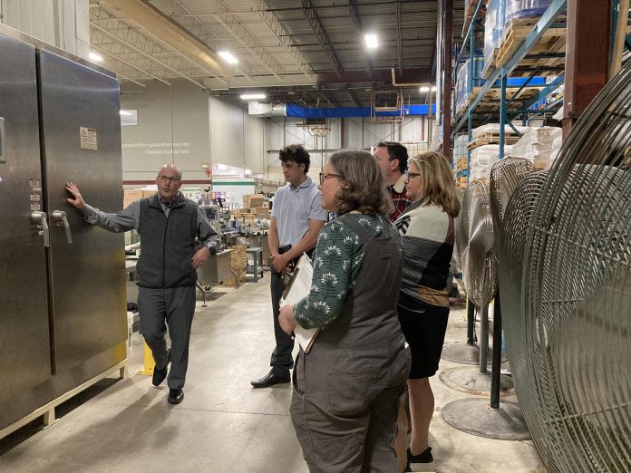 Charlotte Products CEO Matt Strano leads GreenUP and Charlotte Products staff on a tour of the company's Peterborough facility, highlighting how local sourcing and collaboration drive the manufacturer's sustainability success. (Photo: Jackie Donaldson / GreenUP)