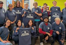 The Peterborough Community Orchard Stewards recently gathered at the GreenUP office for an end-of-season lunch. Pictured here taking a break from reflection and goal setting to show off their newly printed T-shirts, the group tends to 13 fruit orchards planted in neighbourhoods around Peterborough. (Photo: Tegan Moss / GreenUP)