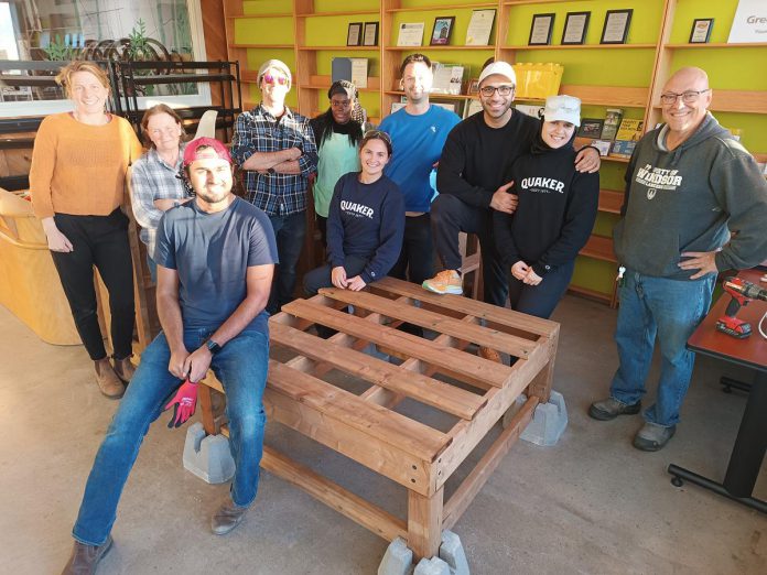 Volunteers from PepsiCo Foods Canada - Quaker and the Orchard Stewards teamed up with local carpenters to build five sturdy stands to support and elevate the water totes at each of the community fruit orchards in Peterborough. (Photo: Christina Balint / GreenUP)