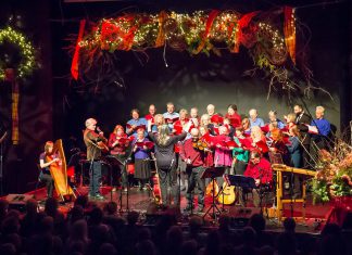 Carried Away and the Convivio Chorus performing at the 2015 In From The Cold concert at Market Hall Performing Arts Centre in downtown Peterborough. The 26th annual Christmas benefit concert, which has raised more than $220,000 to date for Peterborough's YES Shelter for Youth and Families, is returning to the Market Hall on December 5 and 6, 2025, featuring an earlier start time on Friday night, a Saturday afternoon matinee, and roots singer-songwriter and multi-instrumentalist Benj Rowland as a special musical guest. (Photo: Linda McIlwain / kawarthaNOW)