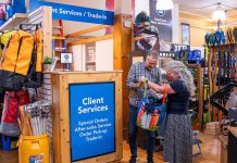 Shop the Boro: Save money and the planet by trading in your outdoor gear at Wild Rock Outfitters in downtown Peterborough Rob Arkell of Wild Rock Outfitters takes a look at clothing brought in by a customer to the trade-in desk for the downtown Peterborough outdoor gear retailer's Wild Again program. Customers can trade in their lightly used premium gear for store credit, which can be used to purchase new or used products or donated to the company's ComPassion Project. The Wild Again program not only makes high-quality outdoor clothing and equipment more affordable for other customers, but diverts items from the landfill and reduces the demand for new production. (Photo: Jeff Faulds / Wild Rock Outfitters)