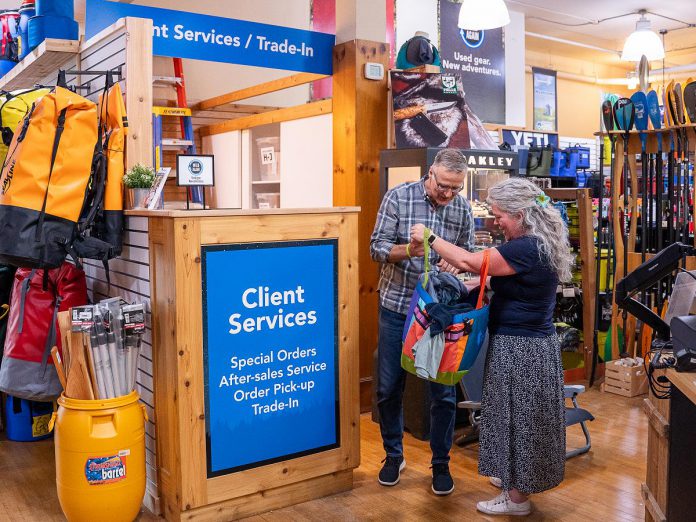 Rob Arkell of Wild Rock Outfitters takes a look at clothing brought in by a customer to the trade-in desk for the downtown Peterborough outdoor gear retailer's Wild Again program. Customers can trade in their lightly used premium gear for store credit, which can be used to purchase new or used products or donated to the company's ComPassion Project. The Wild Again program not only makes high-quality outdoor clothing and equipment more affordable for other customers, but diverts items from the landfill and reduces the demand for new production. (Photo: Jeff Faulds / Wild Rock Outfitters) Rob Arkell of Wild Rock Outfitters takes a look at clothing brought in by a customer to the trade-in desk for the downtown Peterborough outdoor gear retailer's Wild Again program. Customers can trade in their lightly used premium gear for store credit, which can be used to purchase new or used products or donated to the company's ComPassion Project. The Wild Again program not only makes high-quality outdoor clothing and equipment more affordable for other customers, but diverts items from the landfill and reduces the demand for new production. (Photo: Jeff Faulds / Wild Rock Outfitters)