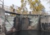 Parks Canada is replacing the upper and lower lock gates at Lock 20 - Ashburnham in Peterborough from November 2025 through April 2026. As pedestrians using the Trans Canada Trail normally cross the lock via the yellow bridge at the top of the lock gates, Parks Canada will be installing a temporary bridge to allow pedestrian access to the trail during the construction period. (Photo: Bruce Head / kawarthaNOW)