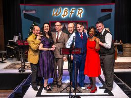 The entire original cast from New Stages Theatre's 2023 production of "It's a Wonderful Life: A Live Radio Show" will be reprising their roles when the show returns to Market Hall Performing Arts Centre in downtown Peterborough for six performances from December 10 to 14, 2025. From left to right: Brad Brackenridge, Megan Murphy, director Mark Wallace, Kerry Griffin, M. John Kennedy, Ordena Stephens-Thompson, and musical director Gabriel Vaillant. (Photo: Dahlia Katz)