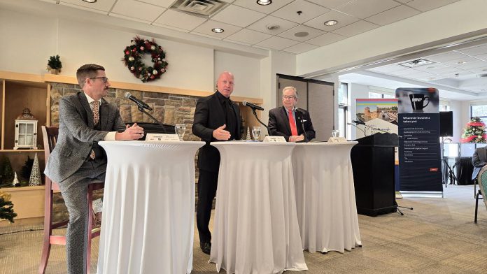 Peterborough and Kawarthas Chamber of Commerce board vice chair Ben vanVeen (left) moderated a question-and-answer session with Peterborough police chief Stuart Betts and Peterborough mayor Jeff Leal during the annual Mayor's Breakfast hosted by Peterborough and Kawarthas Chamber of Commerce at the Peterborough Golf and Country Club on November 27, 2025. (Photo: Jeannine Taylor / kawarthaNOW)