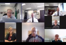 Mayor Jeff Leal reads a motion unanimously approved by the Peterborough police service board in closed session on November 19, 2025 that reaffirmed the board's request for a 9.22 per cent increase in the police service's operating budget in 2026. During budget deliberations on November 18, city council had voted to send the request back to the board for potential reductions. (kawarthaNOW screenshot)