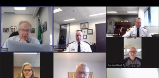 Mayor Jeff Leal reads a motion unanimously approved by the Peterborough police service board in closed session on November 19, 2025 that reaffirmed the board's request for a 9.22 per cent increase in the police service's operating budget in 2026. During budget deliberations on November 18, city council had voted to send the request back to the board for potential reductions. (kawarthaNOW screenshot)