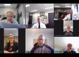 Mayor Jeff Leal reads a motion unanimously approved by the Peterborough police service board in closed session on November 19, 2025 that reaffirmed the board's request for a 9.22 per cent increase in the police service's operating budget in 2026. During budget deliberations on November 18, city council had voted to send the request back to the board for potential reductions. (kawarthaNOW screenshot)