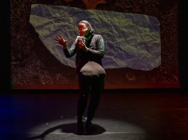 In "who will save the night sky?" on November 9, 2025 at Trent University's Nozhem First Peoples Performance Space, Métis-Jewish performer Philip Geller's Trickster-like character invites the audience to a "starry boardroom" where celestial beings debate the fate of Earth and its two-legged inhabitants. With many thousands of satellites in orbit, Geller uses humour and subversion to inspire reflection on the modern forces that obscure humanity's ancient relationship with the stars. (Photo: Kate Dalton)