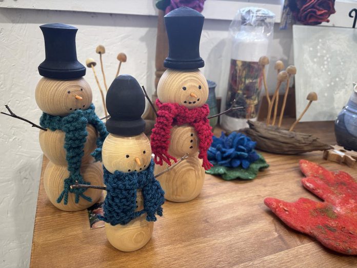 The Christmas in the Annex exhibition being held at A Place for the Arts in Bancroft until December 28, 2025, features work under $50 from 22 local artists in a range of mediums, including small canvas paintings, photographs, figurines, puzzles, and more. (Photo: Megan Gallant / kawarthaNOW)