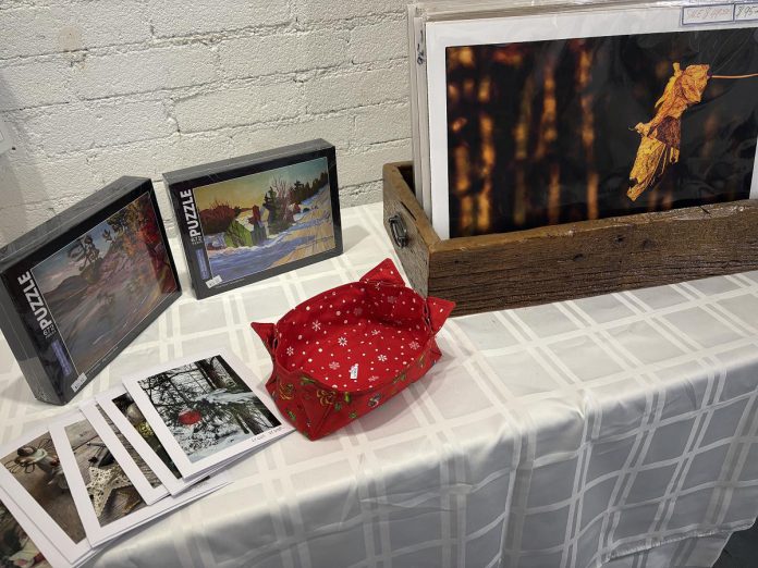 With original puzzles, cards, figurines, and photographs all priced under $50, the Christmas in the Annex exhibition at A Place for the Arts in Bancroft until December 28, 2025 is a great place to stock up on affordable holiday gifts of locally made artwork. (Photo: Megan Gallant / kawarthaNOW)