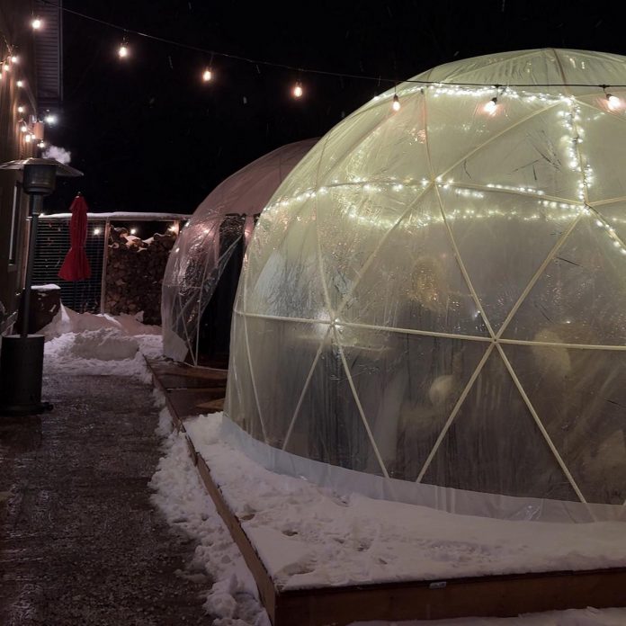 The snow domes at The Cheeky Duck Vineyard make for an intimate and cozy gathering for dining as well as for special occasions including corporate dinners, bachelorette parties, birthdays, and more. For head chef and founder Josh Keepfer, dining outdoors is reminiscent of the "Canadian cottage way" as people share food over the dinner table. (Photo courtesy of Cheeky Duck Vineyard)