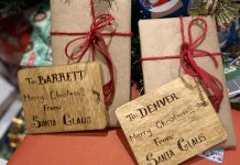 Rethinking the gift wrap: reducing holiday waste without reducing the joy Thoughtfully chosen and long-lasting materials can replace single-use options for gift giving without sacrificing the festive spirit. Not only are these gifts wrapped in non-glossy paper and decorated with non-plastic bows, the gift tags are carved into wood and offer a keepsake in of themselves. (Photo: Natalie Stephenson / GreenUP)