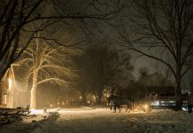 A horse-drawn wagon ride through Lang Pioneer Village Museum in Keene is one of the many activities available during the family-friendly "Christmas by Candlelight" event taking place from 4 to 8 p.m. on December 6 and 7, 2025. (Photo: Heather Doughty Photography)