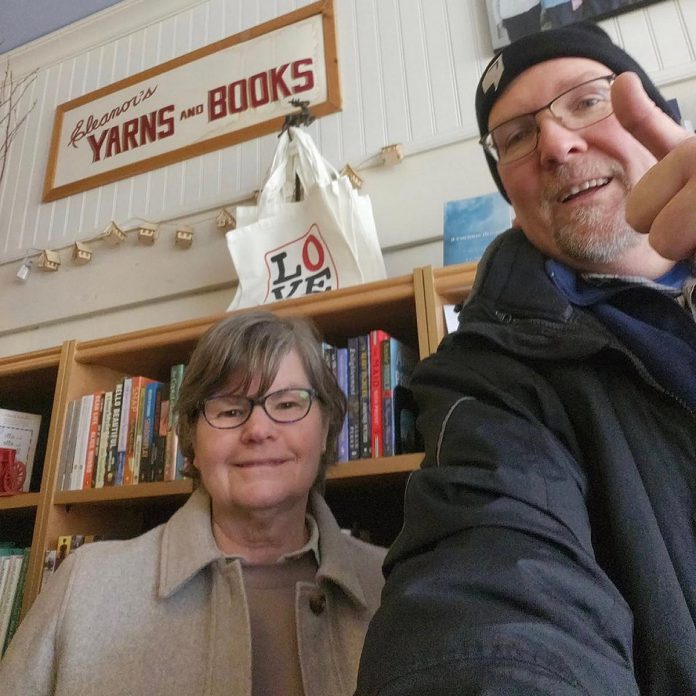Chris Jones, satellite director of Lakefield Youth Unlimited, drops off "Love Lakefield" tote bags to Susan Twist at Happenstance Books & Yarn. The $20 tote bag, which comes with a matching magnet, can also be purchased at IDA Pharmacy, the Selwyn Public Library Makerspace, Stuff Store, The Nutty Bean Cafe, Ecco Art Gallery, and the Lakefield Youth Unlimited barn. Sale proceeds will support Lakefield Youth Unlimited's Christmas gift card drive for local families in need this holiday season. (Photo: Chris Jones)
