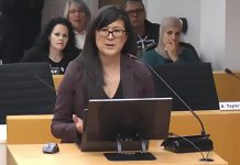 Sacha Lai-Svirk, volunteer board chair of the Peterborough Downtown Business Improvement Area (DBIA), addresses Peterborough city council during a meeting on December 1, 2025 to consider a proposed by-law that would see the City of Peterborough assume administrative control of a $150,000 annual payment from the city to the DBIA as part of a 20-year settlement agreement made in 2017. (kawarthaNOW screenshot of City of Peterborough video)